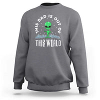 Charcoal gray dad-style sweatshirt with alien graphic and 'THIS WORLD' front print