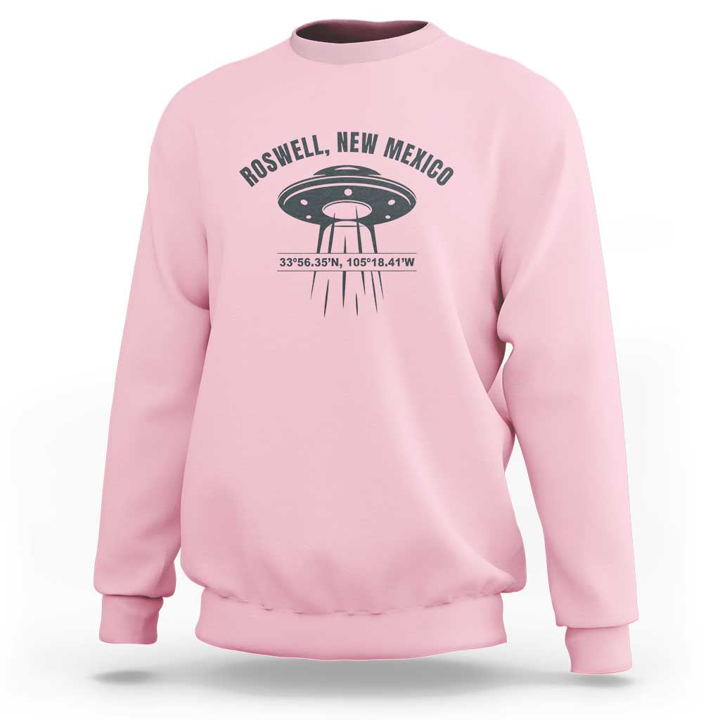Light pink UFO alien sweatshirt with Roswell, New Mexico text and flying saucer graphic
