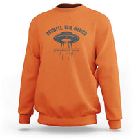 Orange UFO alien sweatshirt with Roswell, New Mexico text and flying saucer graphic
