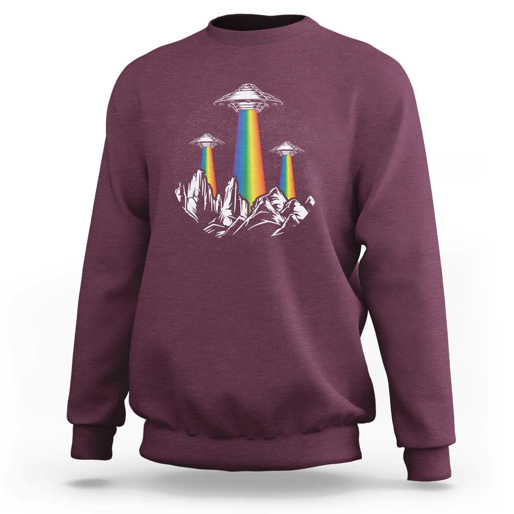 Maroon sweatshirt with rainbow UFO graphic and city skyline print on chest