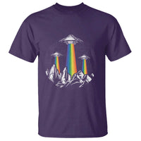 Purple graphic T-shirt with rainbow UFO lights over mountain silhouette