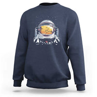 Navy crewneck sweatshirt with astronaut graphic on chest