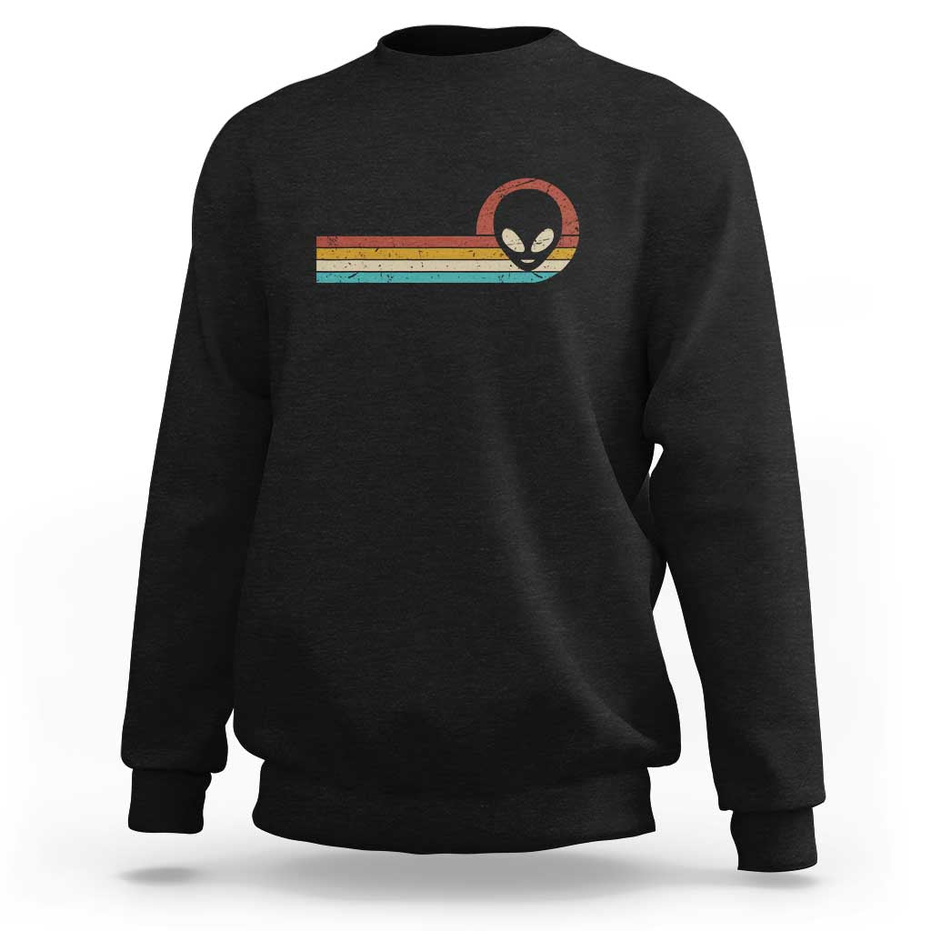 Black crewneck sweatshirt with colorful alien UFO graphic on chest