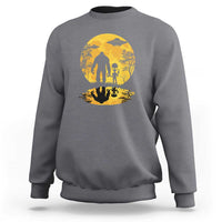 Dark heather gray sweatshirt with yellow moon Bigfoot alien UFO silhouette graphic