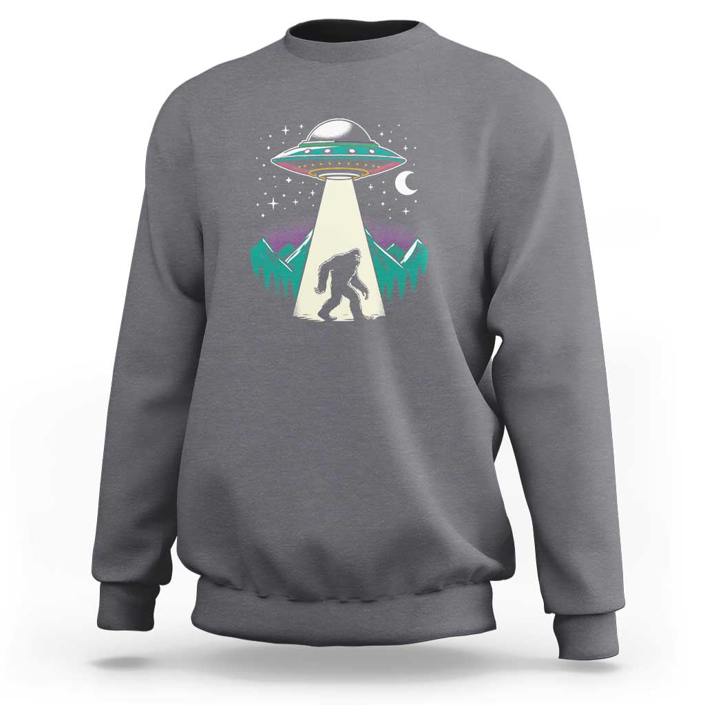 Charcoal crewneck sweatshirt with UFO and Bigfoot graphic on chest