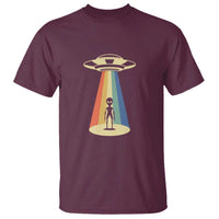Maroon alien abduction graphic T-shirt with UFO and person in colorful beam