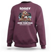 Maroon crewneck sweatshirt with long sleeves and front graphic print