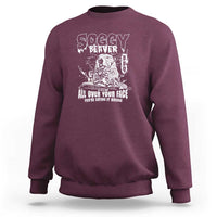Maroon crewneck sweatshirt with white beaver face graphic and All over your face text