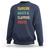 Navy funny BBQ sweatshirt with colorful "SMOKING MEATS & CLAPPING CHEEKS" print
