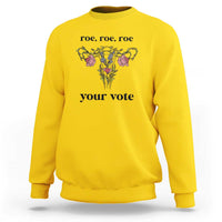Daisy yellow sweatshirt with floral graphic and text 'roe, roe, roe' and 'your vote'.