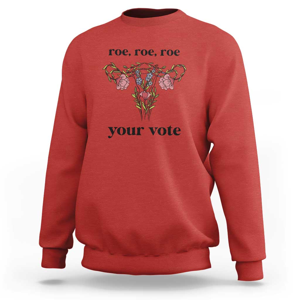 Red sweatshirt with floral graphic and text 'roe, roe, roe' and 'your vote'.