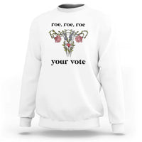 White sweatshirt with floral graphic and text 'roe, roe, roe' and 'your vote'.