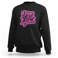 Black crewneck sweatshirt with pink “Dope Chick Fresh Lipstick” graphic on chest