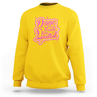 Daisy yellow crewneck sweatshirt with pink “Dope Chick Fresh Lipstick” graphic on chest