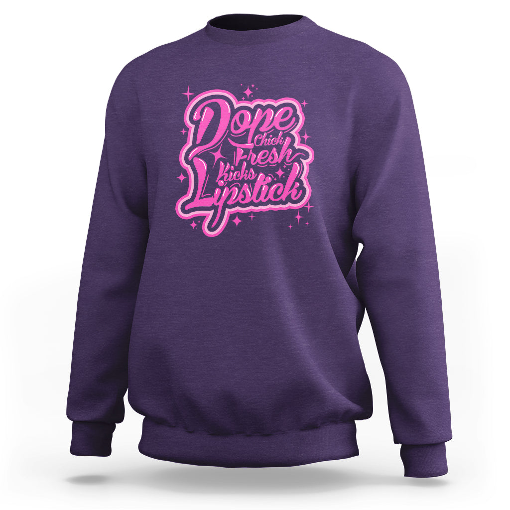 Purple crewneck sweatshirt with pink “Dope Chick Fresh Lipstick” graphic on chest