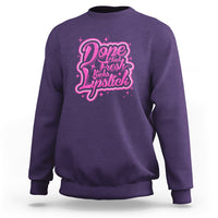 Purple crewneck sweatshirt with pink “Dope Chick Fresh Lipstick” graphic on chest