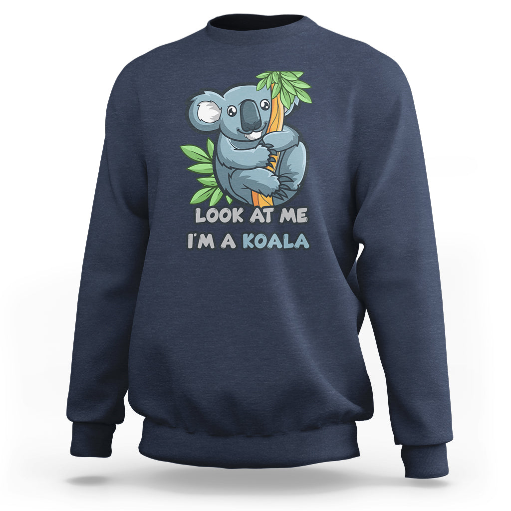 Navy koala graphic sweatshirt with “Look at me I’m a koala” front print, long sleeves.