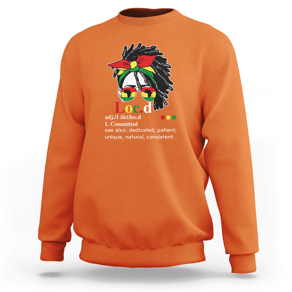 Orange women’s crewneck sweatshirt with long sleeves and front graphic print.
