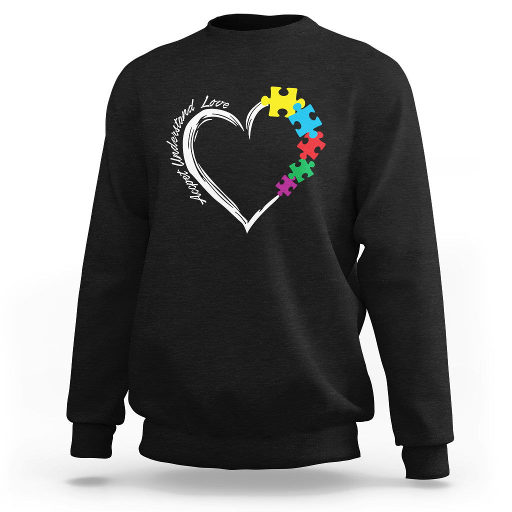 Black autism acceptance sweatshirt with white heart and colorful puzzle pieces graphic