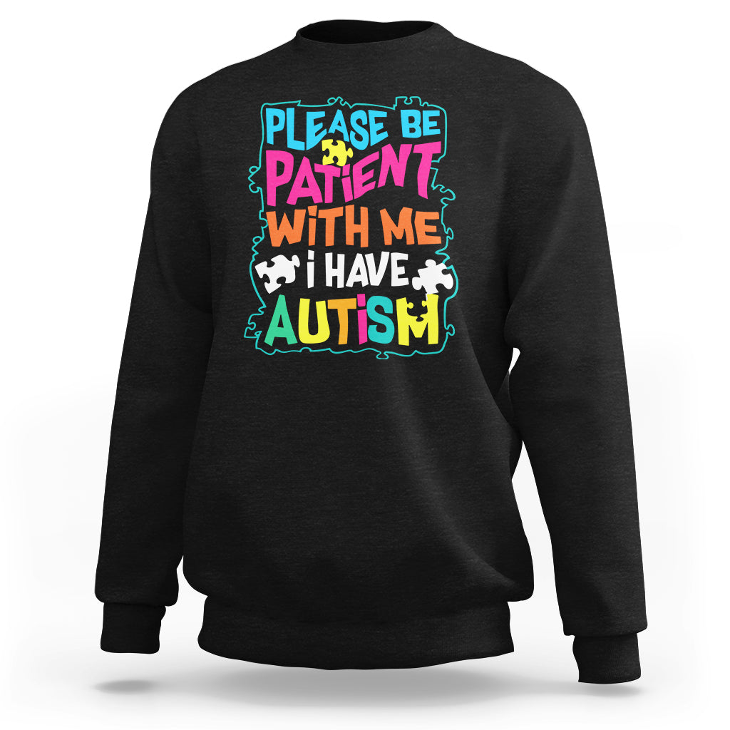 Black autism sweatshirt with colorful “Please be patient with me” graphic
