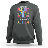 Charcoal autism awareness sweatshirt with colorful front graphic and slogan
