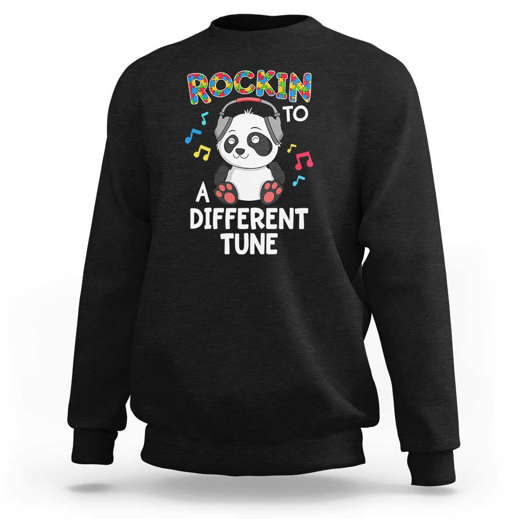 Kids black sweatshirt with panda graphic and "Rockin' to a Different Tune" text