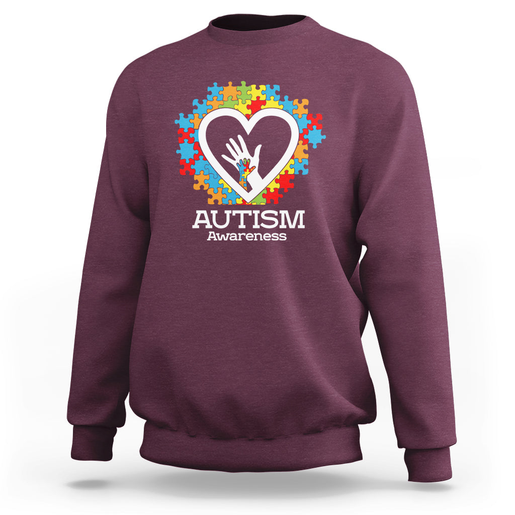 Maroon autism awareness sweatshirt with heart puzzle graphic and 'Autism Awareness' text