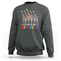 Charcoal crewneck sweatshirt with colorful giraffe graphic and “It’s OK to be Different” text.