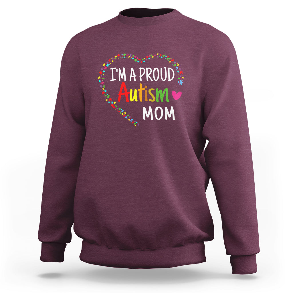 Maroon sweatshirt with "I'm a proud Autism Mom" rainbow arched graphic