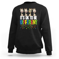Black sweatshirt with giraffe graphic and colorful “It’s ok to be different” text