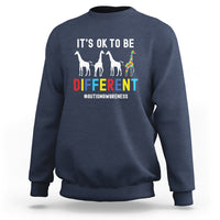 Navy autism sweatshirt with “It’s ok to be different” giraffe graphic on front