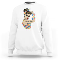 White crewneck sweatshirt with autism-themed face graphic on chest.