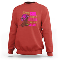 Red crewneck sweatshirt with colorful “Every GIRL needs a little rip in her jeans” graphic