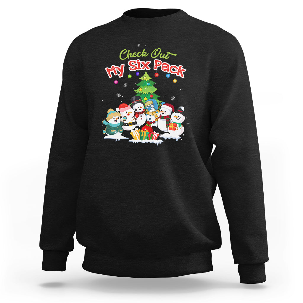 Black snowman sweatshirt with “Check Out My Six Pack” graphic and six snowmen scene.