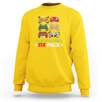 Daisy yellow crewneck sweatshirt with festive gaming graphic and CHECK OUT MY SIX PACK text
