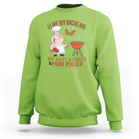 Lime green BBQ sweatshirt with cartoon chef graphic and rib/pork text on chest