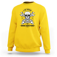 Yellow crewneck sweatshirt with skull mechanic graphic, banner text, and crossed tools