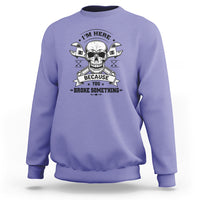 Violet crewneck sweatshirt with skull mechanic graphic, banner text, and crossed tools