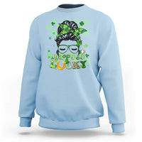 Light blue crewneck sweatshirt with green shamrock hair girl graphic and “Happy Go Luck” text.