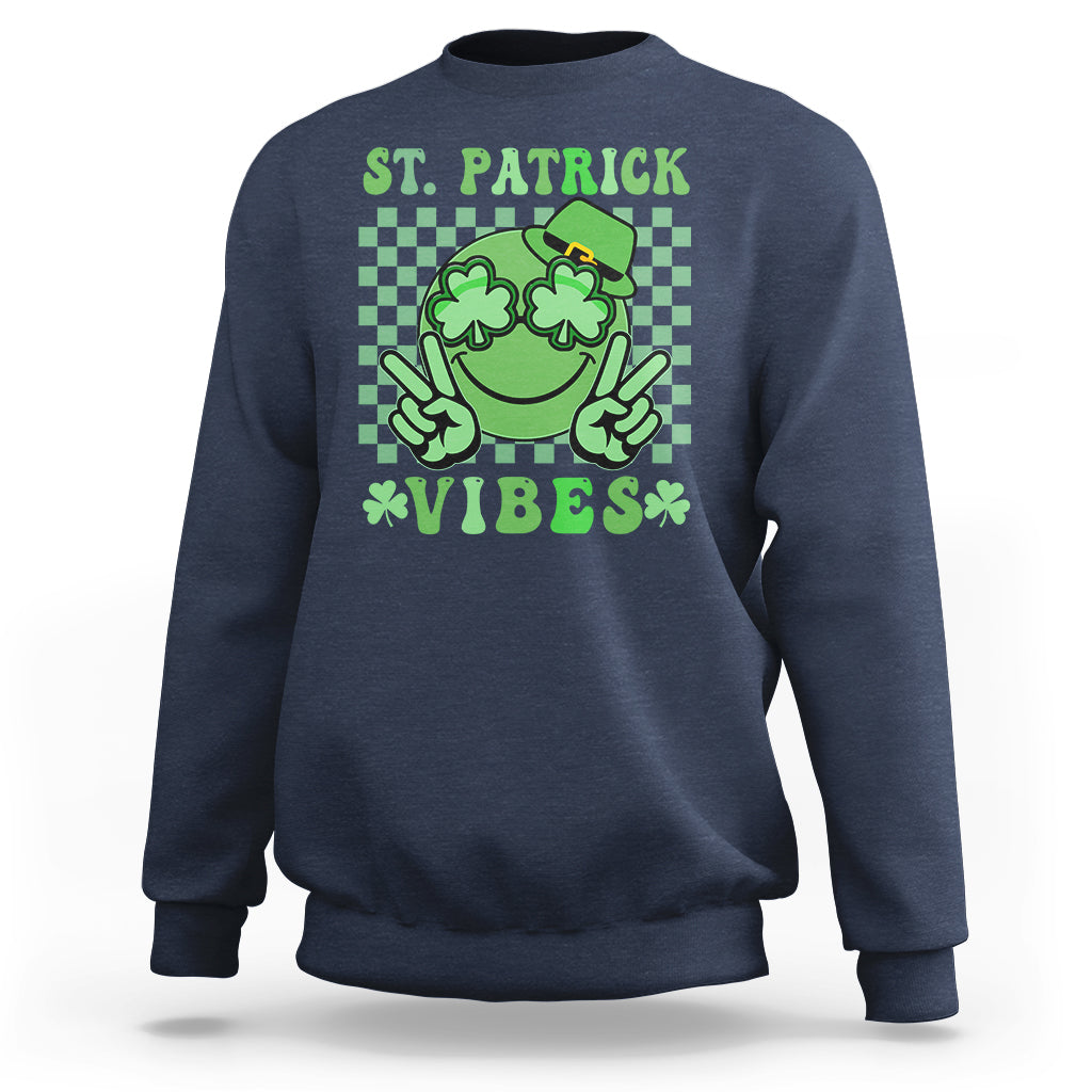 Navy St. Patrick sweatshirt with green shamrock character and text 'VIBES'