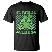 St. Patrick's Day t-shirt in black with green shamrock face and 'VIBES' graphic