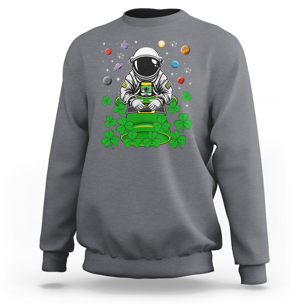 Charcoal gray crewneck sweatshirt with astronaut leprechaun space-themed graphic on front