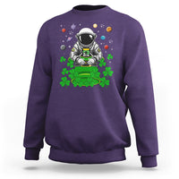 Purple crewneck sweatshirt with astronaut leprechaun space-themed graphic on front