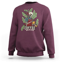 Maroon crewneck sweatshirt with skull barista graphic and “COFFEE DEALER” text