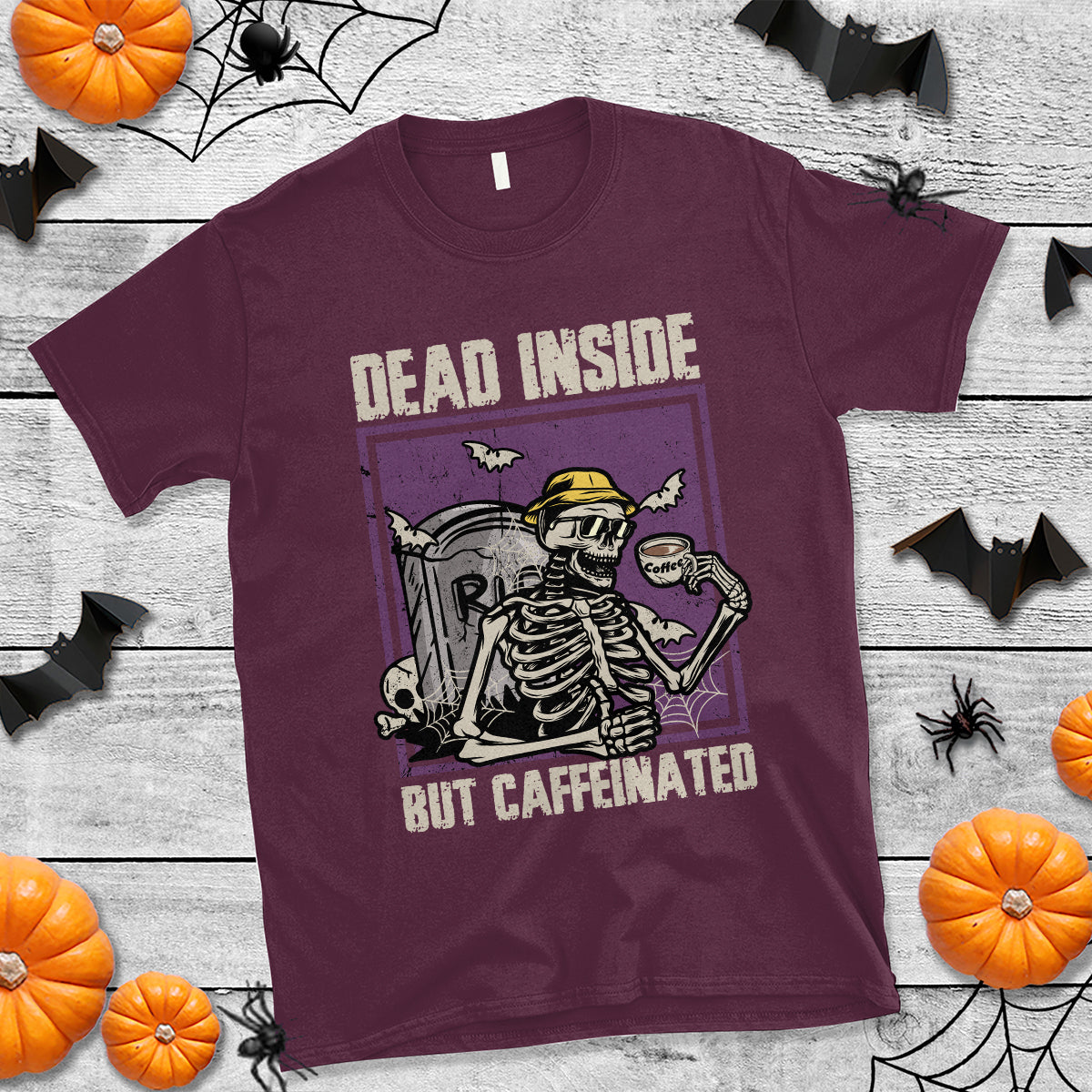 Maroon Halloween T-shirt with skeleton graphic and “Dead inside but caffeinated” print