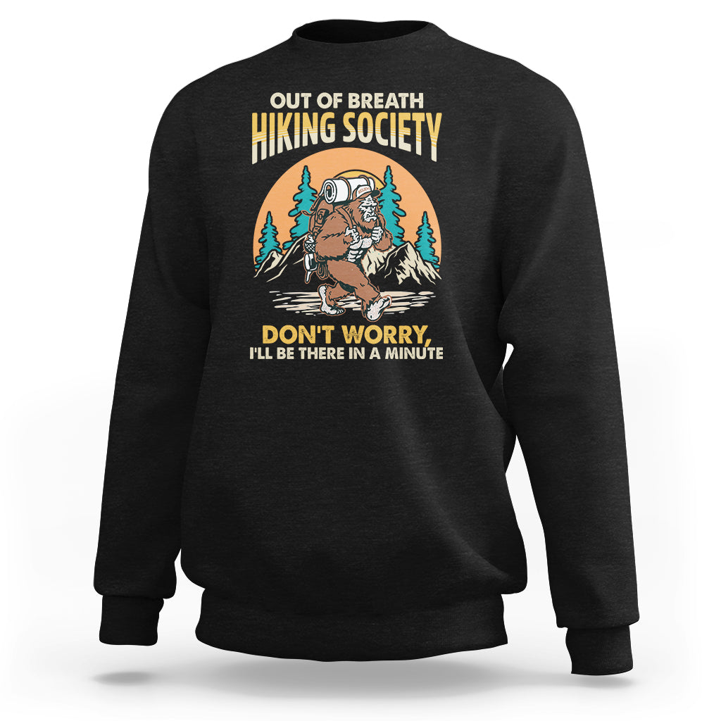 Black crewneck hiking sweatshirt with front Bigfoot-style graphic and yellow text