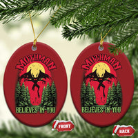 Red oval Mothman Christmas ornaments with “Believes in You” graphic, front views