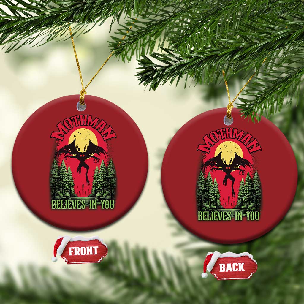 Red round Mothman Christmas ornaments, front and back views, “Believes in You”