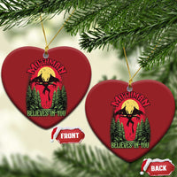 Red heart-shaped Mothman Christmas ornament with “Believes in You” graphic
