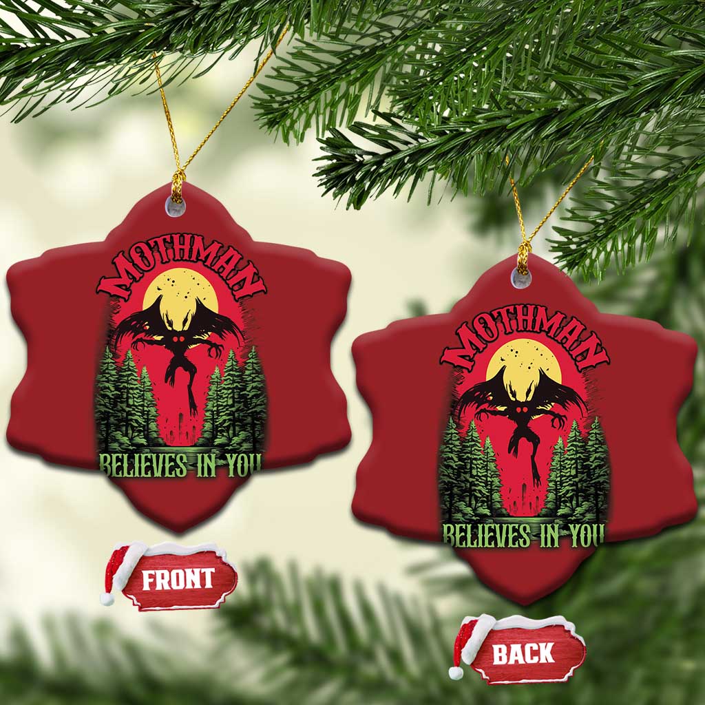 Red heart-shaped Mothman Christmas ornaments, front and back labels, “Believes in You”